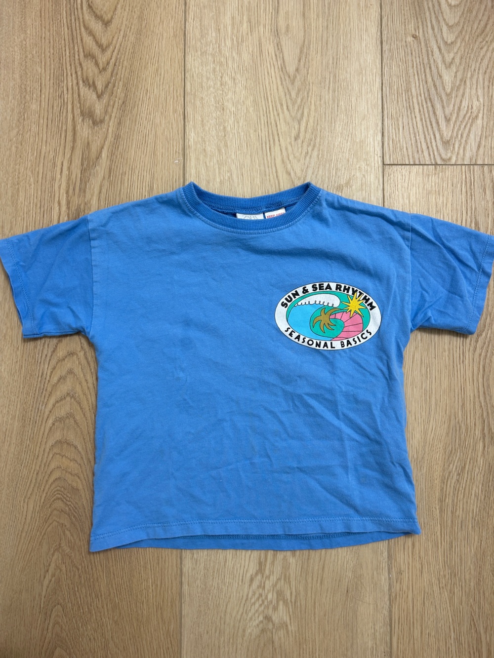 Zara Blue Graphic Tee with Multicolor Surf Badge